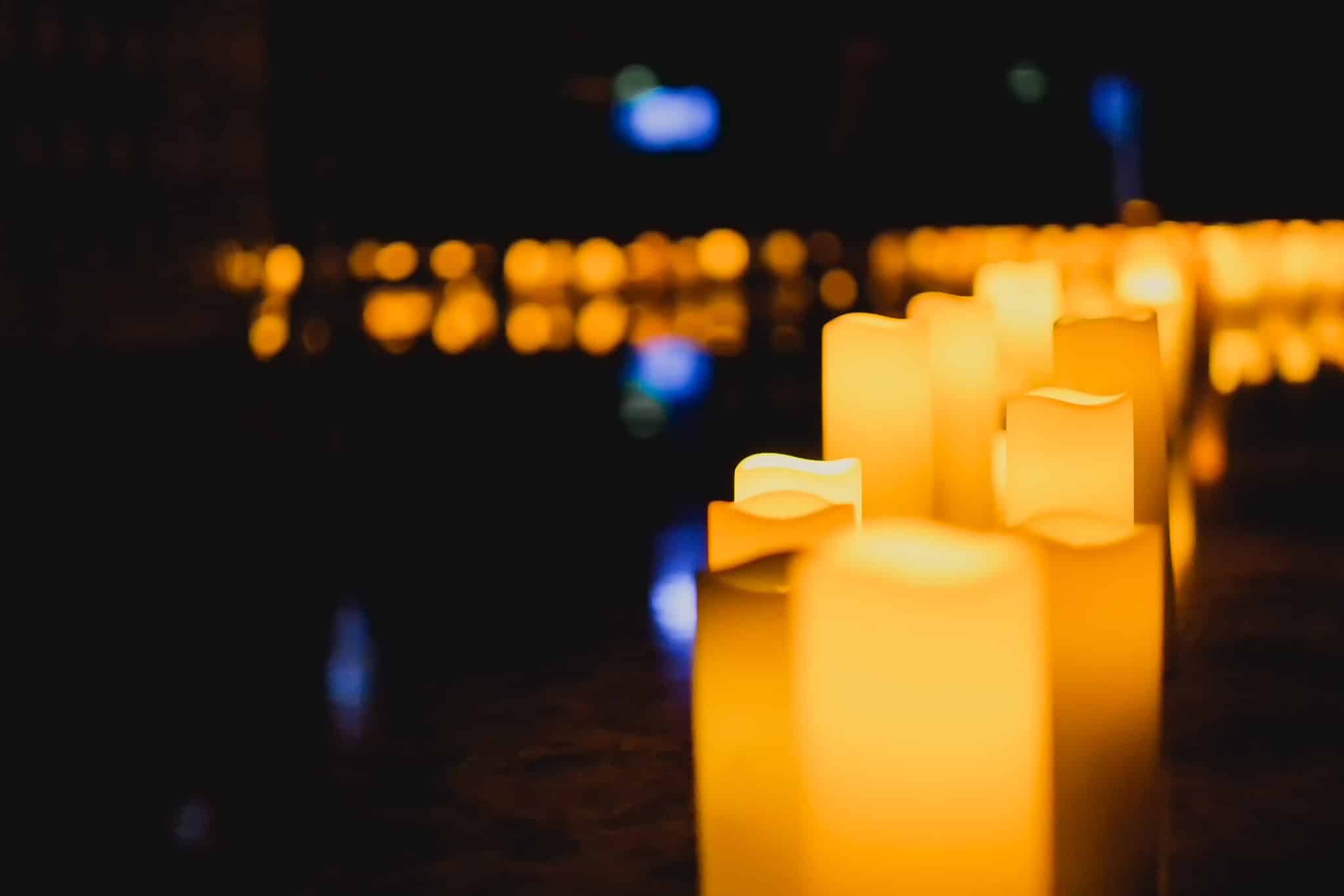 A dark image with a close-up of candles.