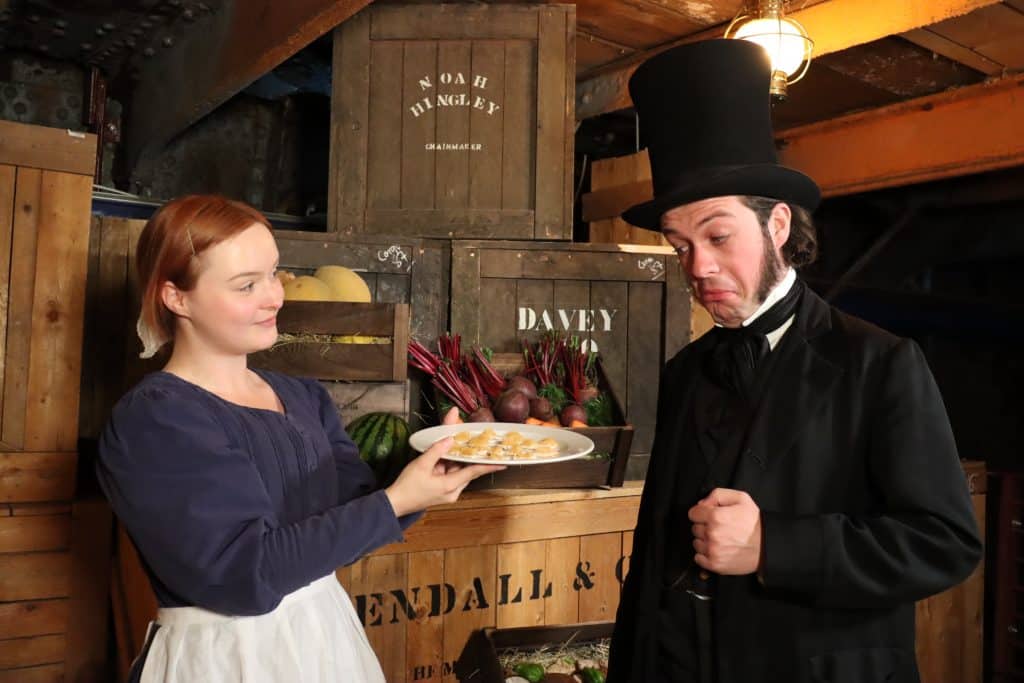 Victorian man eating food aboard the SS Great Britain