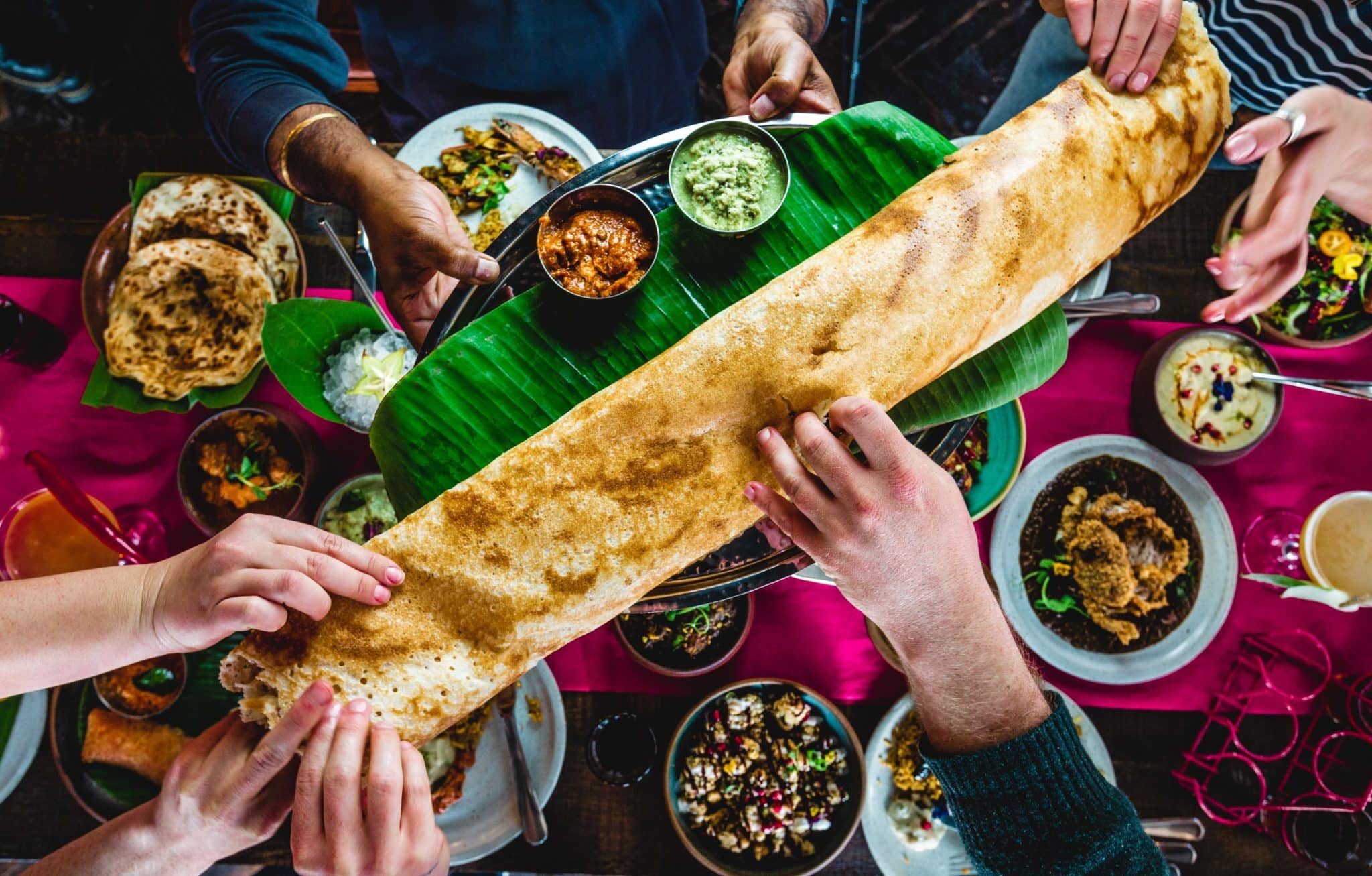 People sharing food at Nadu