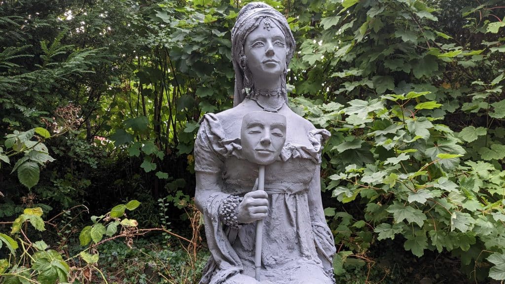A statue of Princess Caraboo by mysterious artist, Getting Up To Stuff, surrounded by trees