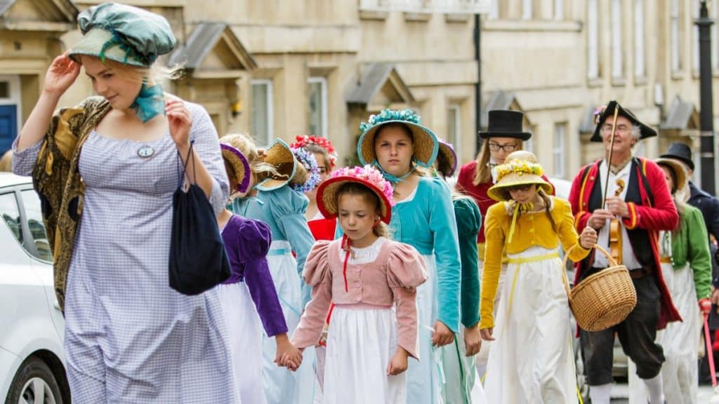 Jane Austen fans dressed in 18th Century costume are pictured taking part in the world famous Grand Regency Costumed Promenade.