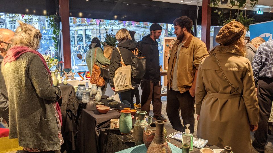 A group of people browsing Chritmas markets in Bristol