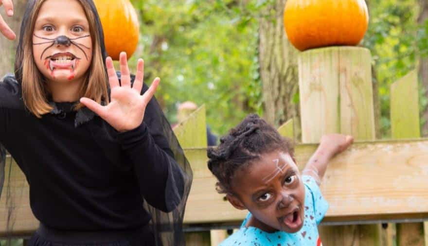 Children with scary Halloween face paint at the Bristol Zoo Project in Bristol