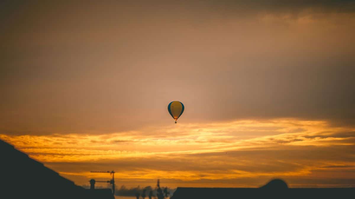 A Bristol sunset with a hot air balloon in the centre of the sky