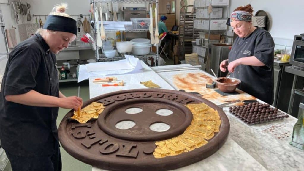 A giant chocolate button being made by Zara's Chocolates for Luke Jerram as part of Bristol 650