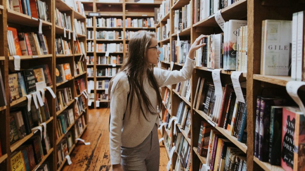 A woman browsing a bookshop