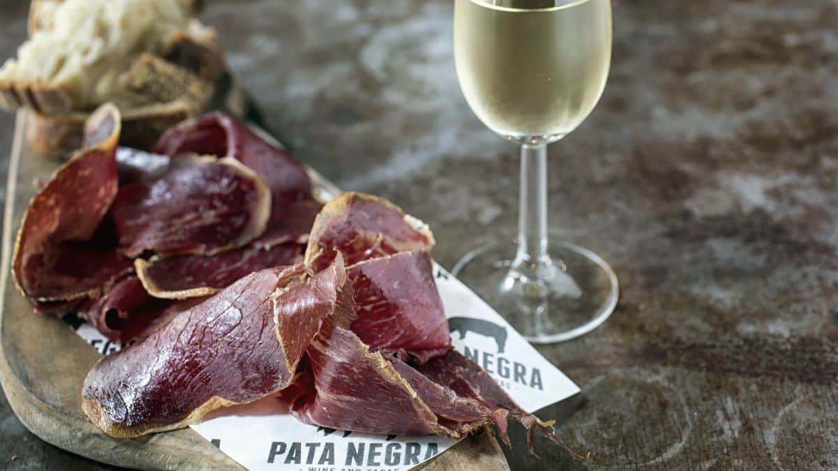 iberico ham and a glass of spanish white wine