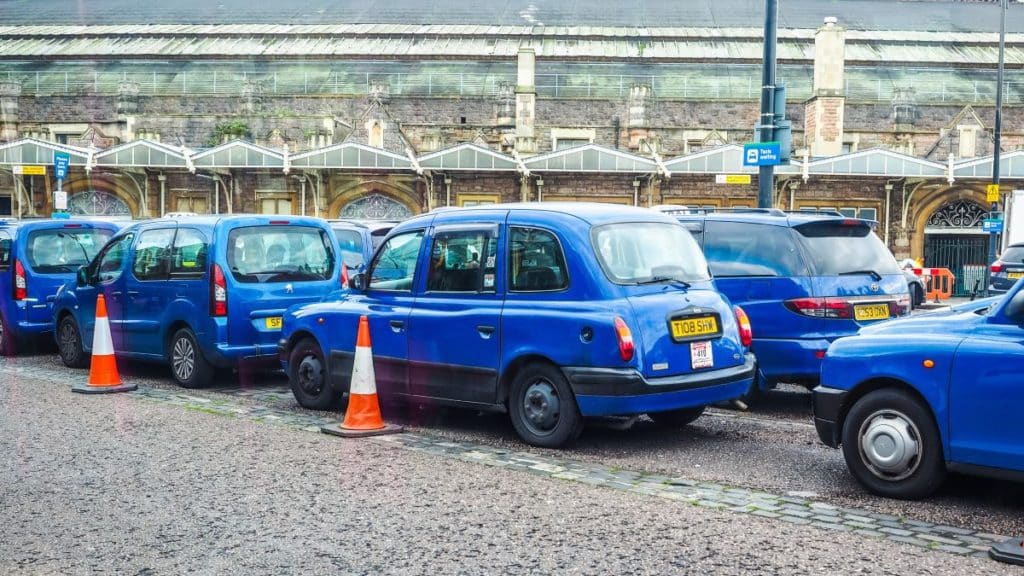 Taxi cabs cars in front of Bristol Temple Meads railway station