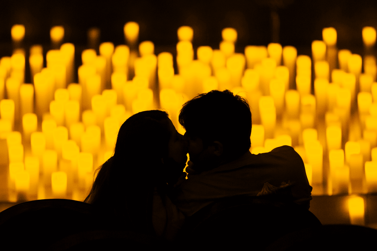 A couple performing by candlelight